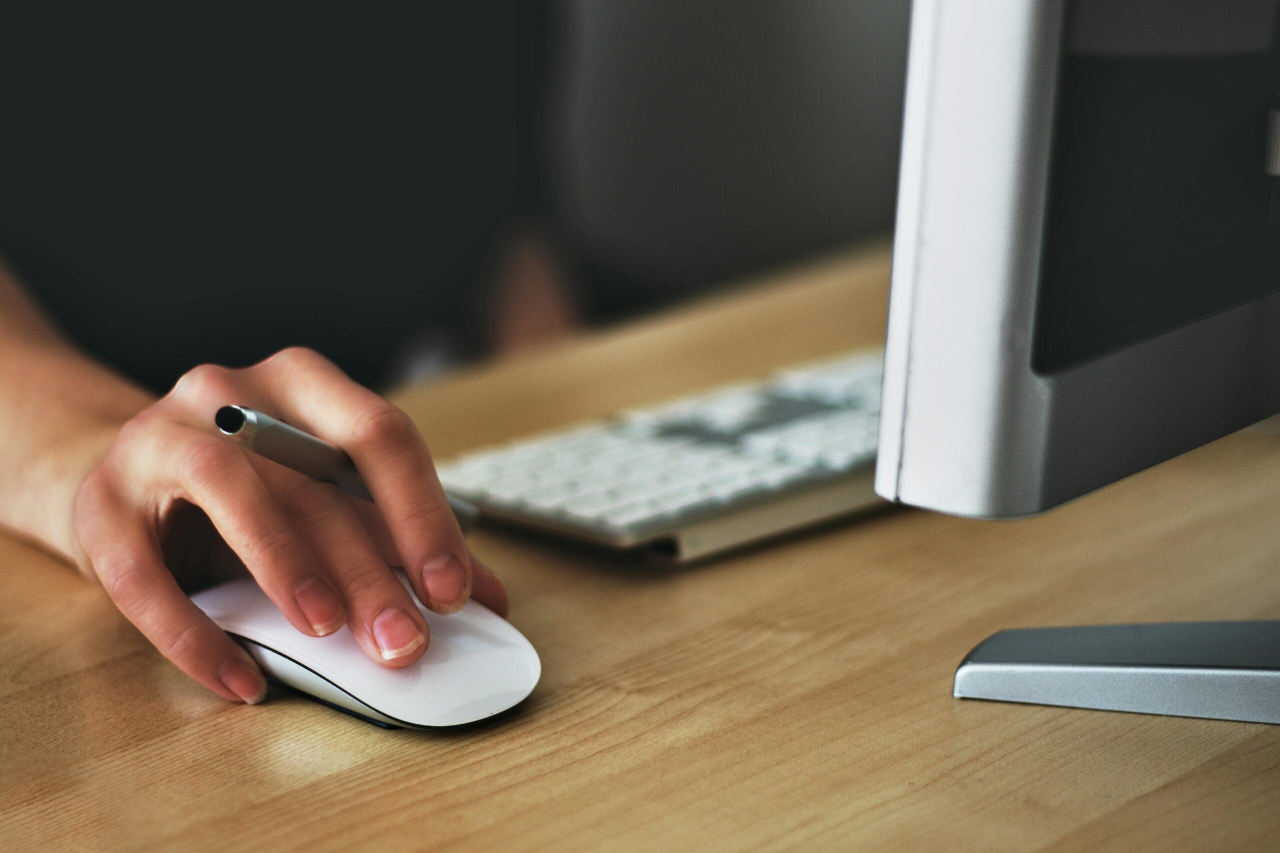 pexels-vojtech-okenka-127162-392018 woman using mouse for business writing